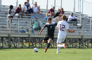 The soccer team prepares to face Lawrence North Aug. 25. Ben Price during the scrimmage against Brebeuf Aug. 8.