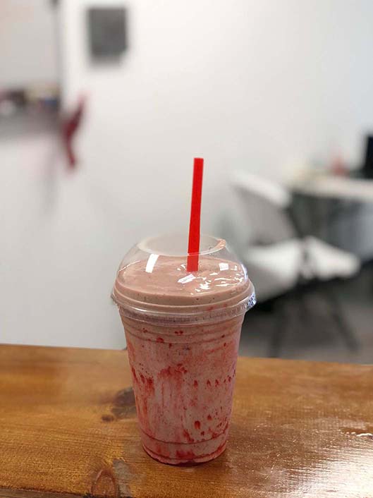 The+strawberry+banana+shake+from+Nutrition+Hub.+Nutrition+Hub+is+located+directly+across+86th+street+from+the+school+building.