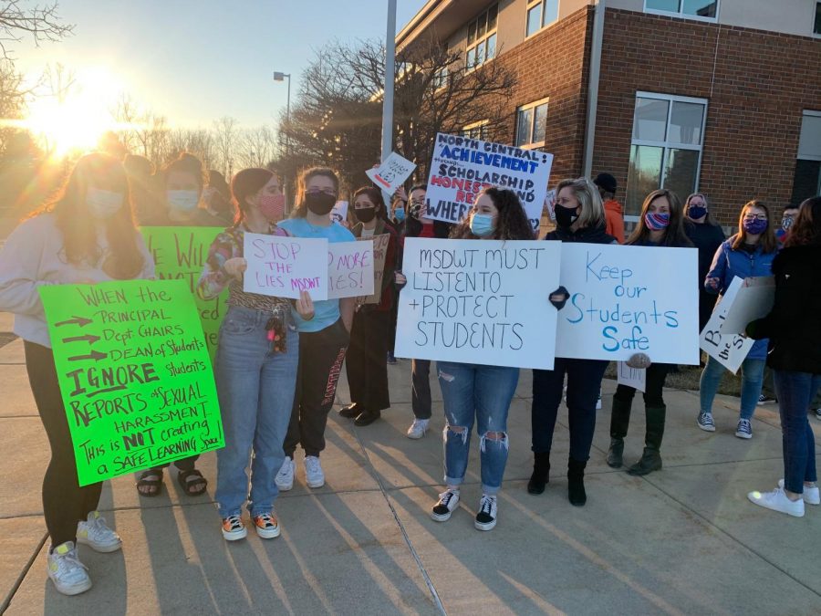 Protesters+gathered+on+Tuesday+at+the+CEC+building.+They+gathered+to+protest+how+the+district+dealt+with+harassment+claims+against+former+teacher+Nathan+Shewell.