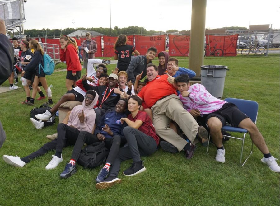 Paul Loggan sits on the soccer couch with upperclassmen from the student section. Each year upperclassmen get the opportunity to enjoy the game from the seats of a comfortable couch. 