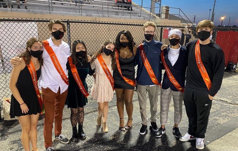 The+2020+Homecoming+court+waits+to+be+escorted+at+the+football+game+the+night+before+the+dance.+The+top+five+Homecoming+king+and+queen+nominees+voted+by+students+are+chosen+to+represent+NC+on+Homecoming+court.+