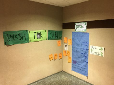 Signs hang on the walls informing students of the canned food drive and Smash for Cash. The canned food drive lasts until December 10 and Smash for Cash ends this Friday. 