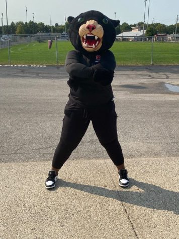 Mascot ShawnDasia Taylor poses in the panther costume before a game. Taylor loves to be at the games with the student section and be able to support the athletes. 