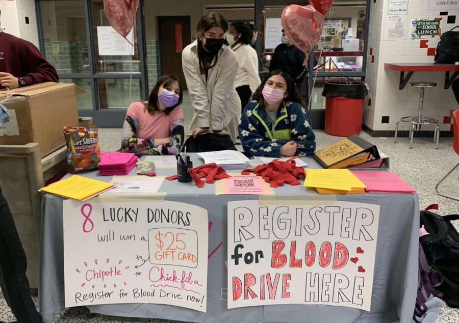 Senior Class Council set up a table at lunch to encourage people to sign up for the blood drive. 