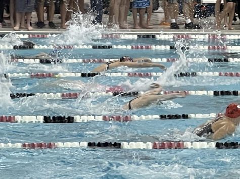 Junior Bridget Collins competes in the 200m butterfly at a NC swim meet. 
