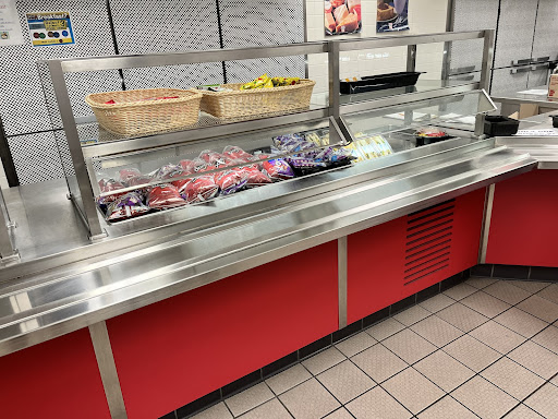 The lunch workers have laid out the sides in preparation for the lunch periods.