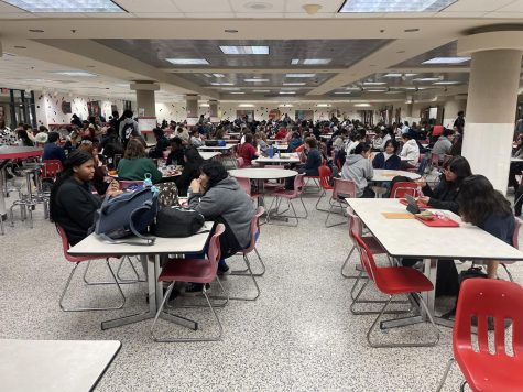 Students eat lunch in the cafeteria.