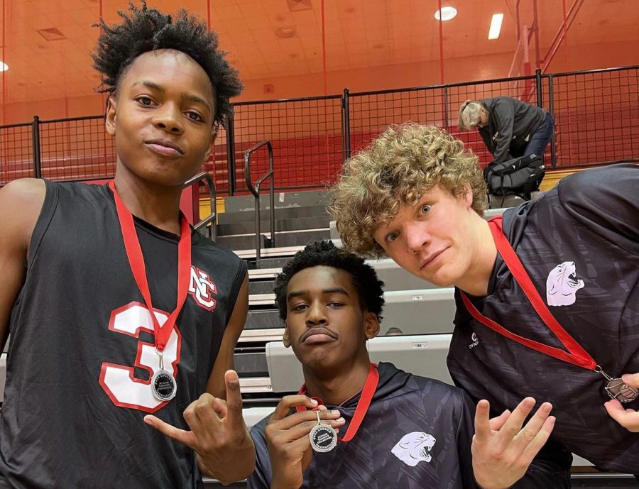 Khalis Smith (middle) posing for a picture after winning the Paul Loggan Invitational last season. 