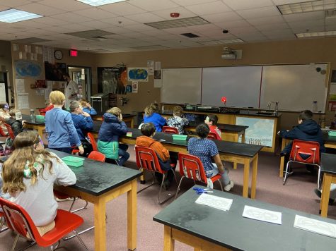 Students participate in an experiment in Saturday Science.