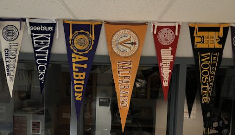 College pennants hang outside the counselors office. 