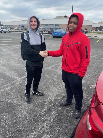Cantrell (left) and Jackson shake hands to end Senior Assassin 2023.