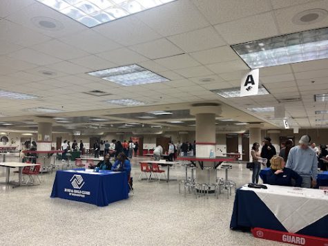 Booths set up across the cafeteria promote job opportunities. 