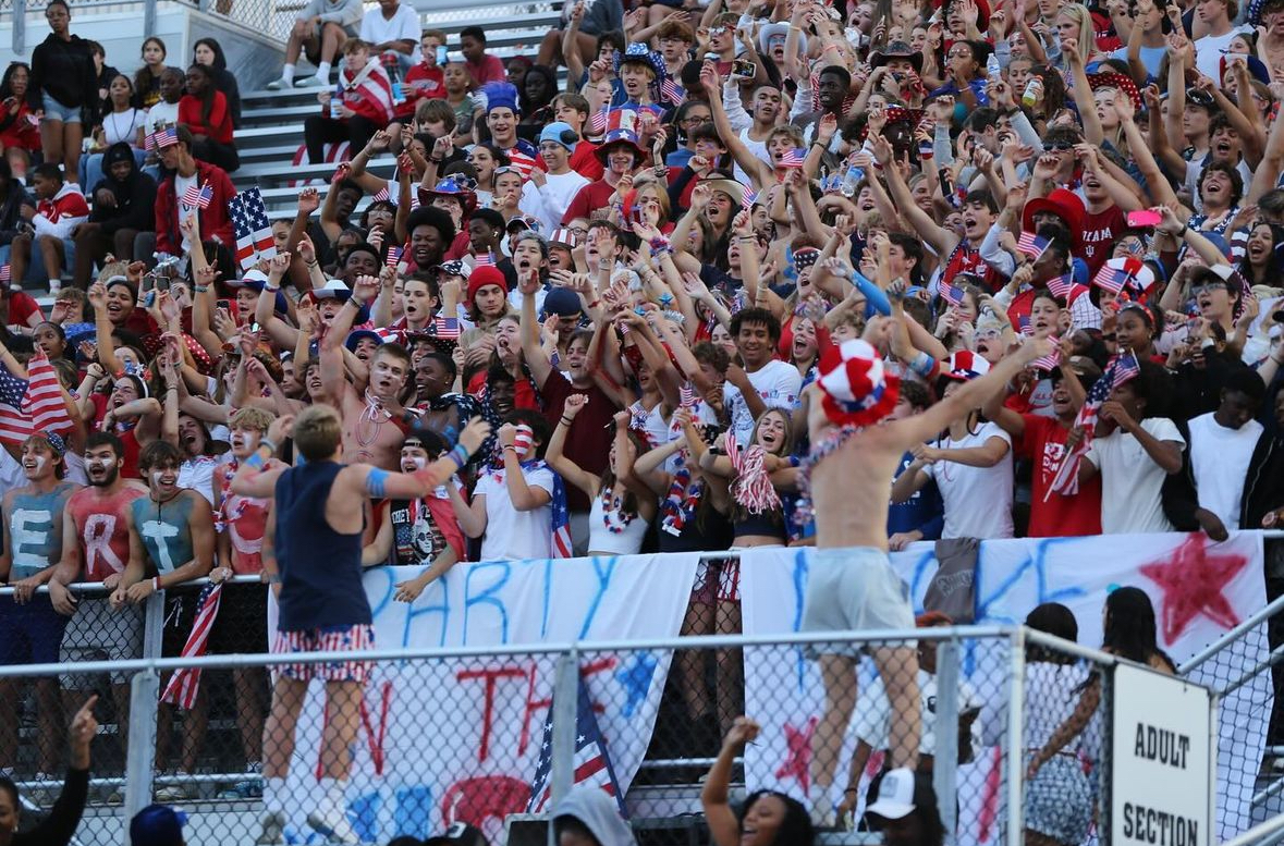 Student section leaders hype up the student section as football plays Warren Central. The banners hung from the stands aided in the student section's selection into the Top 8.