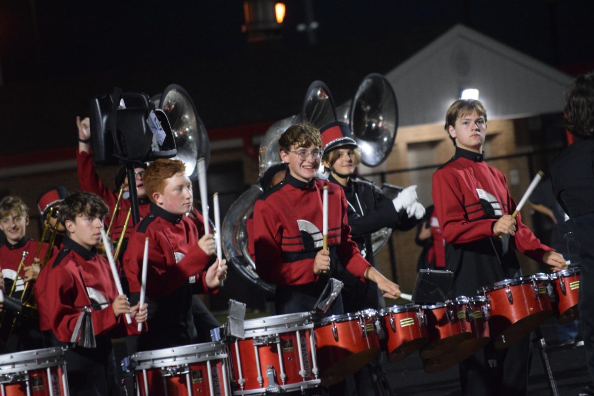 Feshman Lucas Ebersol perfoms with the Marching Panthers during the football game against Fishers. They celebrated NC's 