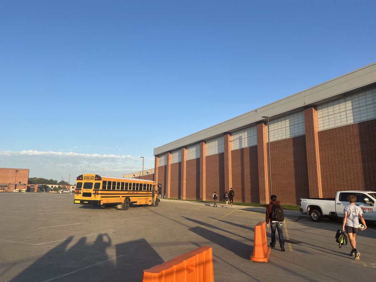 Students walk into school in the morning. Each day a specific bus is selected to go through metal detectors at door 29.