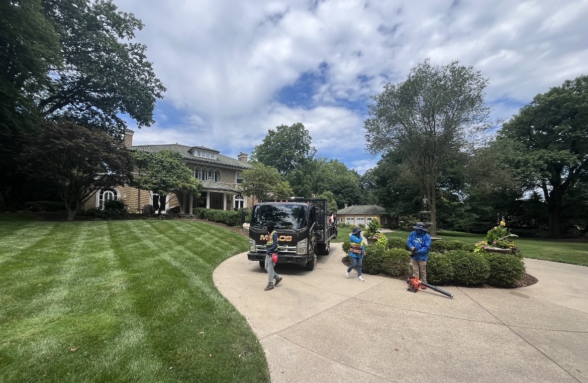 Martin's business tackles lawns ranging big to small. Through years of development, the business can be spotted with its branded trucks and equipment.