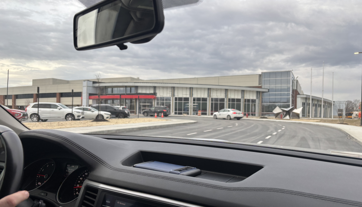 Students enter school through the new door one. While this change has cleared traffic in the senior parking lot, it has complicated entering and leaving the main student parking lot.