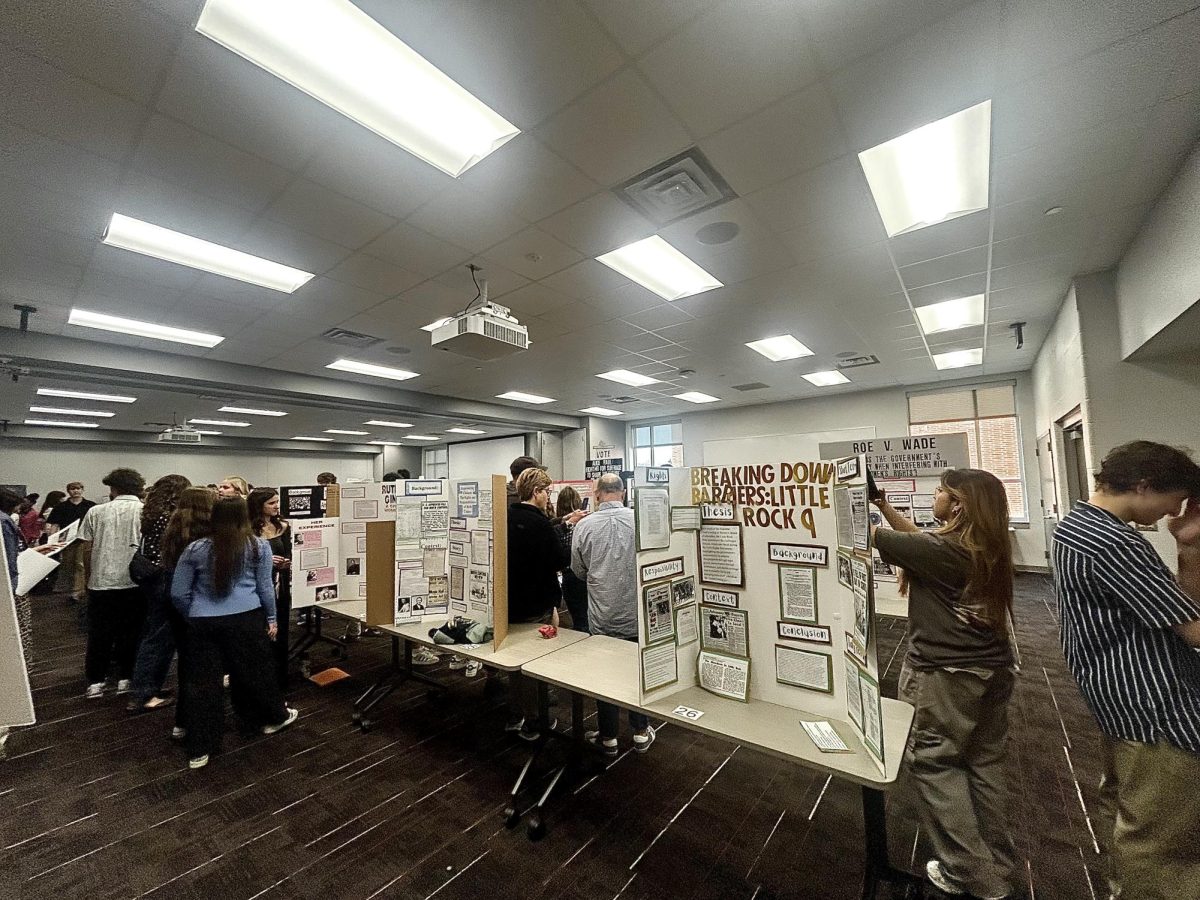 Students present their projects at a NHD showcase at school. They also presented their work in a competition at Carmel on March 15.