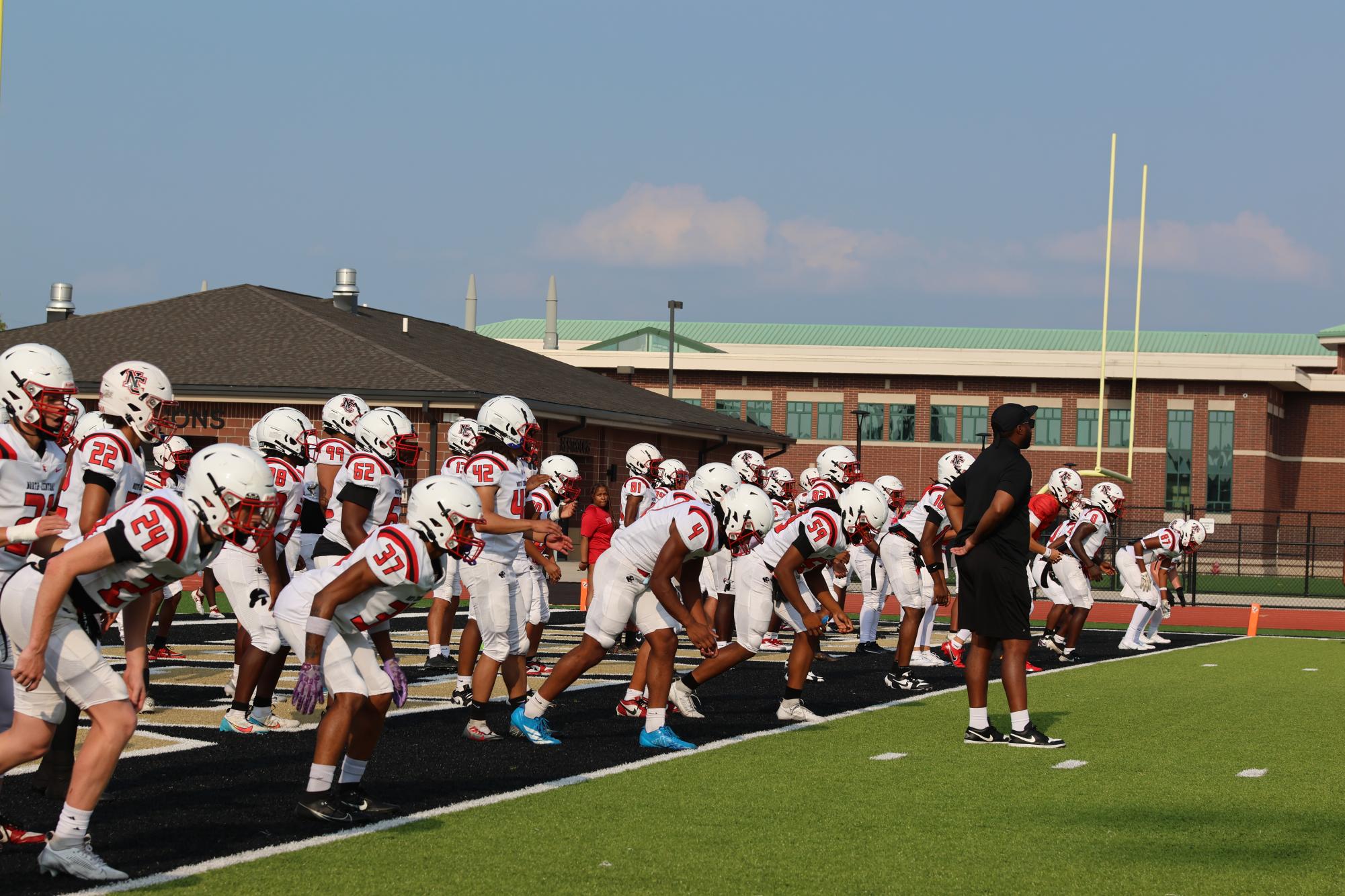 Varsity football preparing for scrimmage against Noblesville.