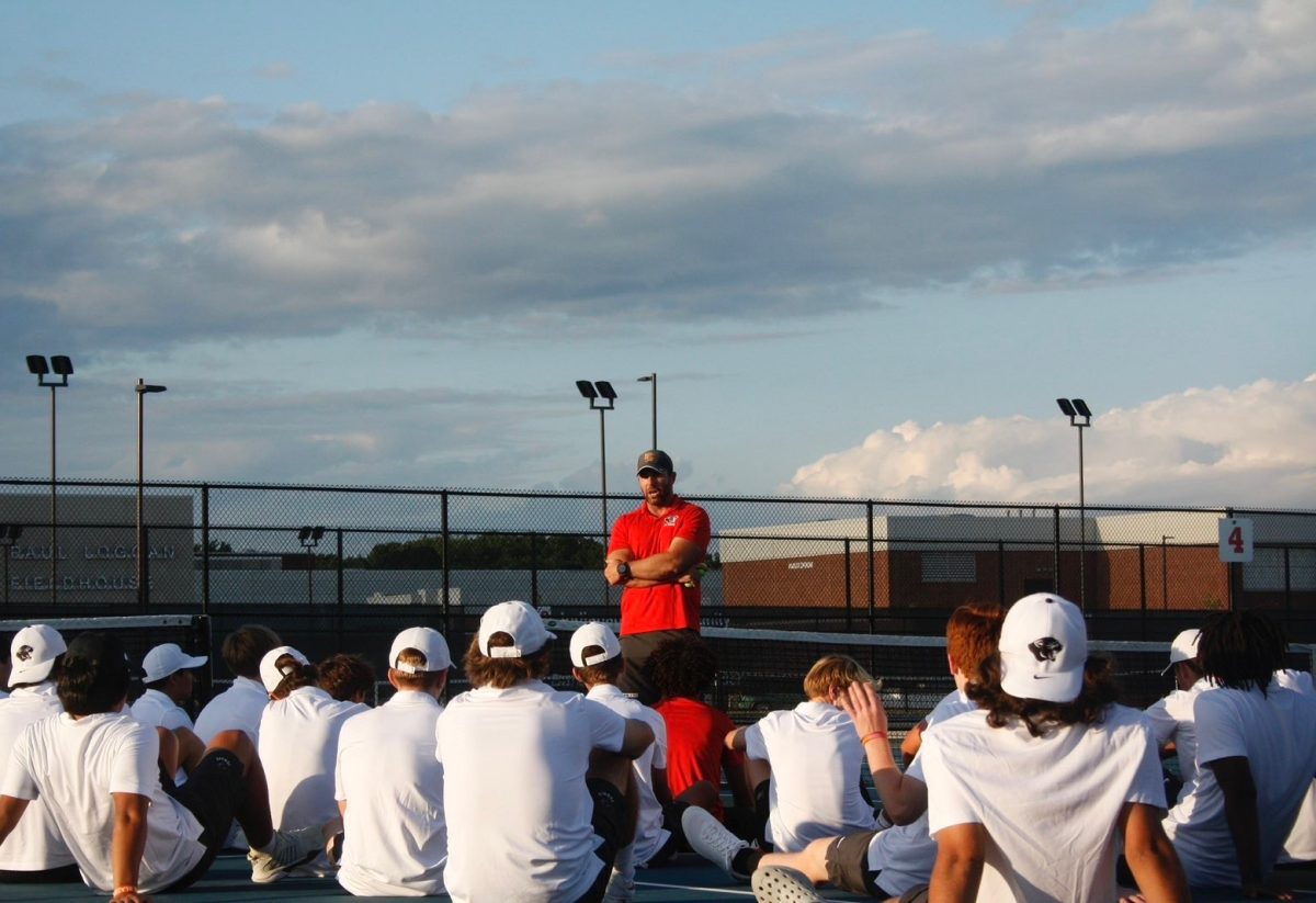 Coach Matt Riley talking to the team after a tough loss to Center Grove.