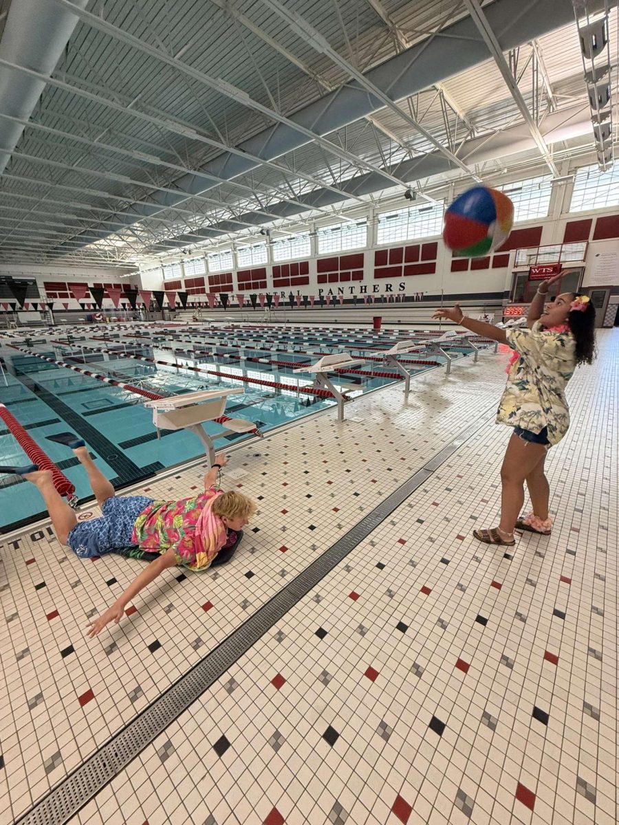 Juniors Finn McMahan and Kaya Avery pose for a social media post, dressed up on Wild West vs. West coast day. They went to the natatorium to correspond with their outfits.  
