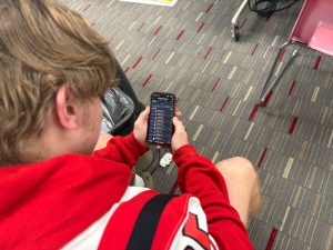 Senior PJ Wever opens up fantasy football app. To check his lineup for the week.