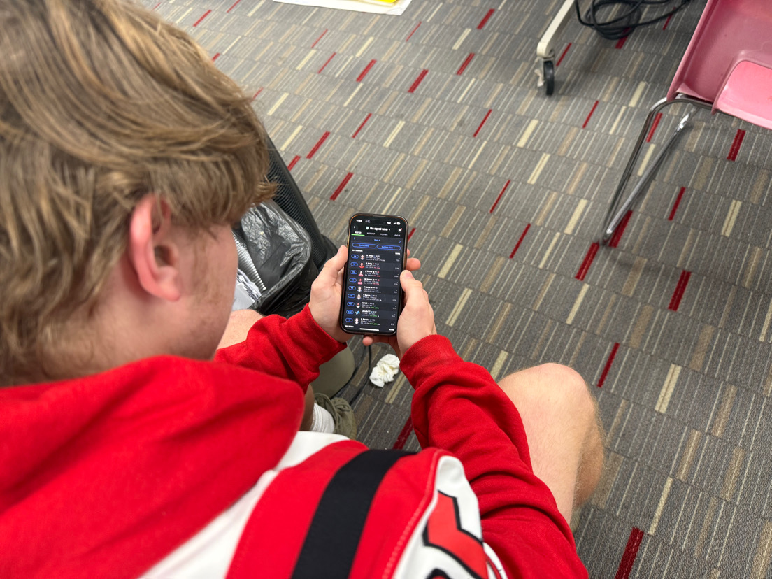 Senior PJ Wever opens up fantasy football app. To check his lineup for the week.