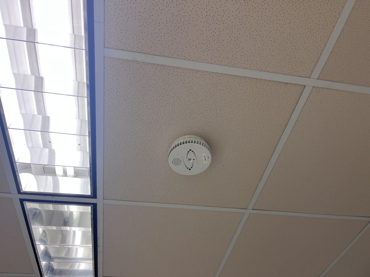 Vape detector near upper M hall way. It will light up when activated.
