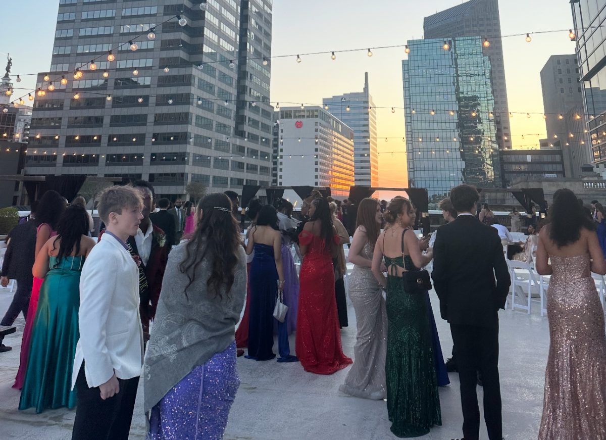 Juniors enjoyed prom by socializing with friends around the fire pits on the outside deck at the Regions Tower.