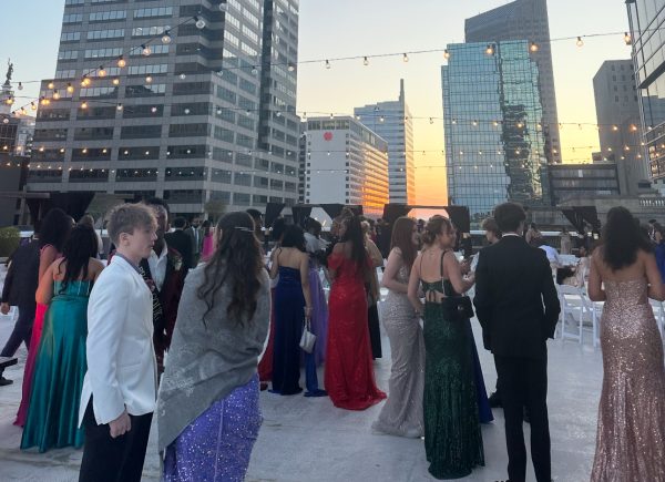 Juniors enjoyed prom by socializing with friends around the fire pits on the outside deck at the Regions Tower.
