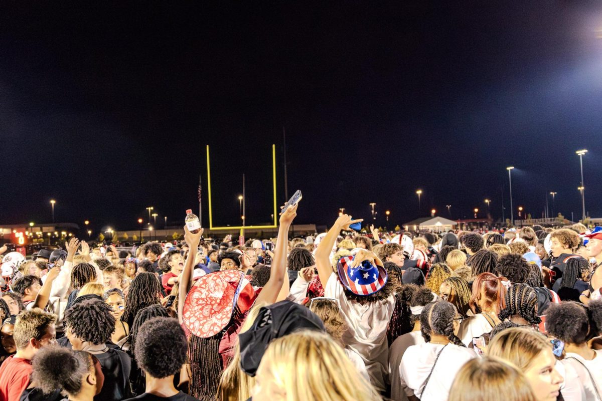 Students Rush the field after beating Brebeuf Jesuit