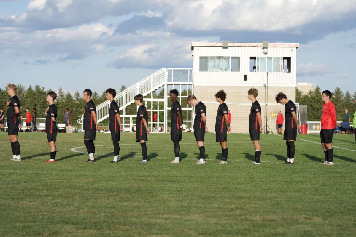 North Central boys line up for the pledge of aligance before game against Lawernce North.