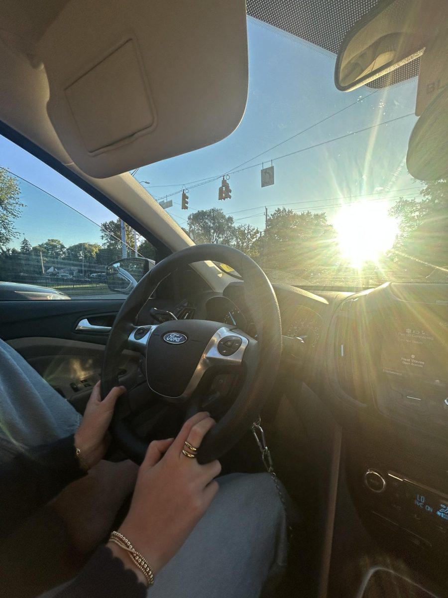 Former student Peri Ingram drives her car around Indianapolis. Teen drivers face conflicts with drinking and driving.
