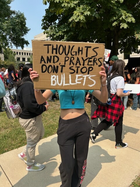 North Central student Greta Gutwein attends Nationwide walkout protesting for change in school safety. As the crowd shouts, she voices her mind in saying, “Thoughts and prayers don’t stop bullets,” a response to a recent post from U.S. president Donald Trump regarding his actions to make schools safer all around. 
