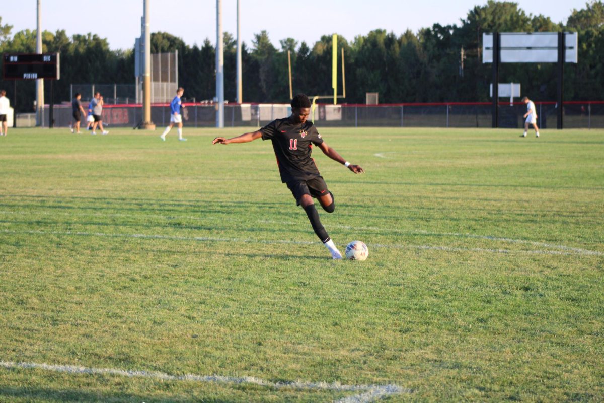 Midfielder, Ahmed Hais, warming up on senior night. The moment captures the effort that the team has made in preparation of their matchup against Carmel High School.
