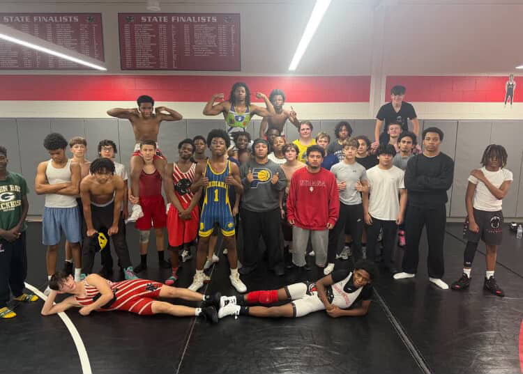 North Central wrestling team takes a team picture after practice. “We fight for each other day in day out.” Team practices everyday in the afternoon except Sunday.