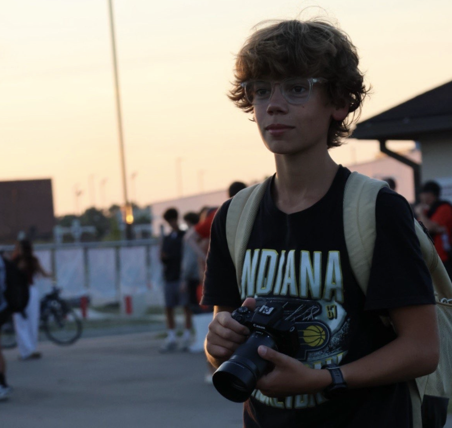 Sophomore Eli Priest spending an evening taking pictures for the North Central Soccer team. 

