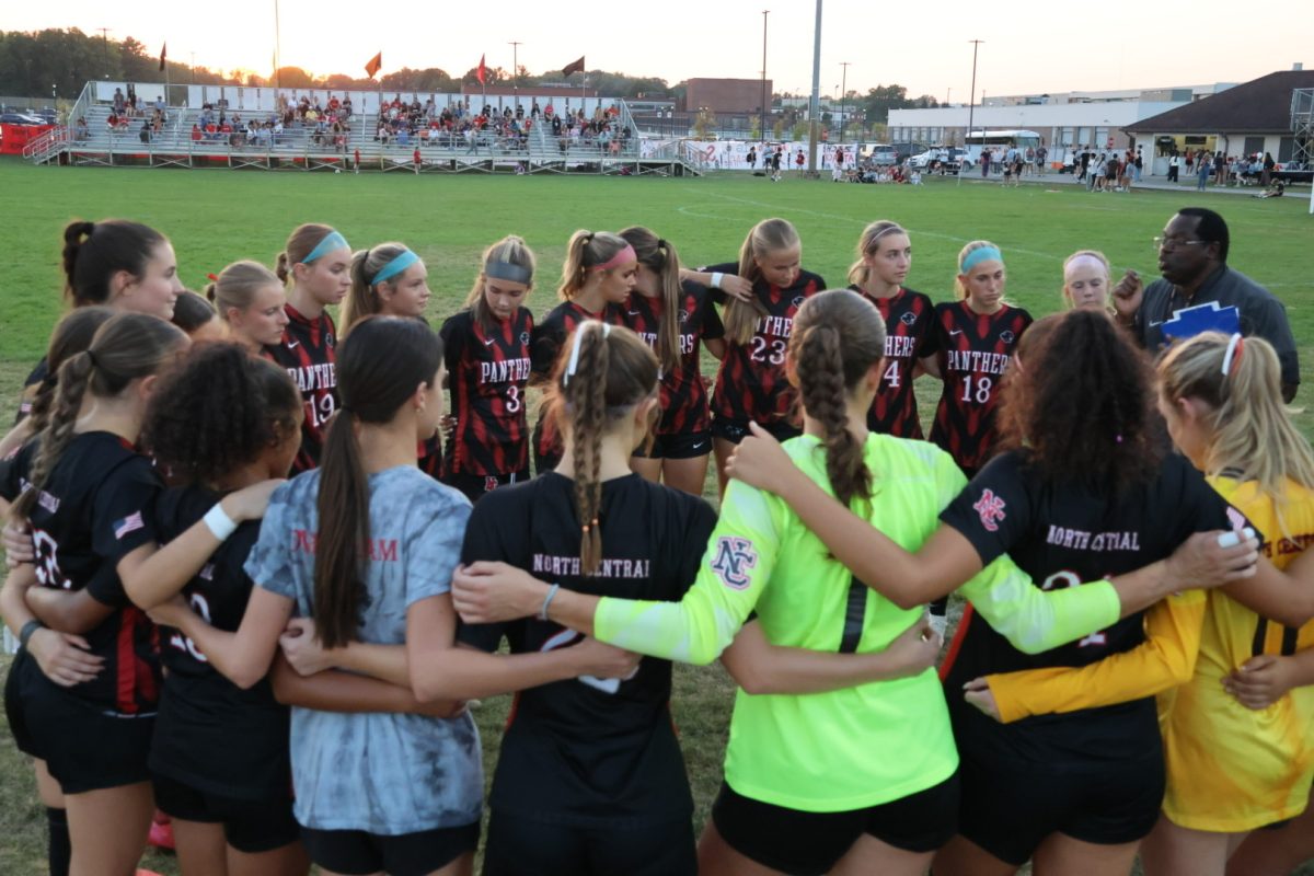 North Central Girls soccer pregame team huddle prepairing for senior night. The North Central Girls won three to zero against Lawrence Central."It was so amazing to see all of our fans come support us," senior Erin Mackey said.