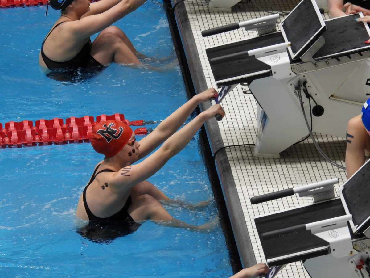 Senior Lillian Tabor gets ready to lead off the 200 Medley Relay. Tabor swam backstroke at the State Championships, helping to lead the relay to a 10th place finish. “I am very proud of how I did at state because I helped our relays get 10th and 12th at the meet,” Tabor said.