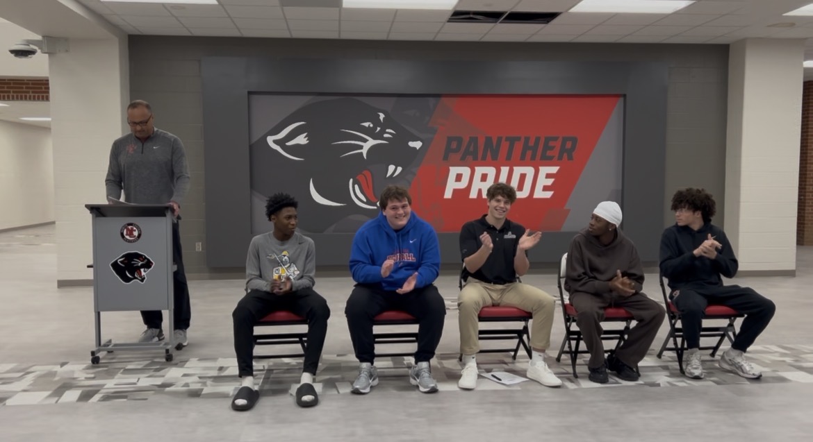 Athletic Director Andy Elkins formally congratulates senior student athletes Ahmed Abdoul-Hais, Sam Dutkanych, Rykin Matthias, Shneider Pierre, and Jaden Wakefield at Signing Day on Feb 11. All five of these athletes will be playing sports in college.
