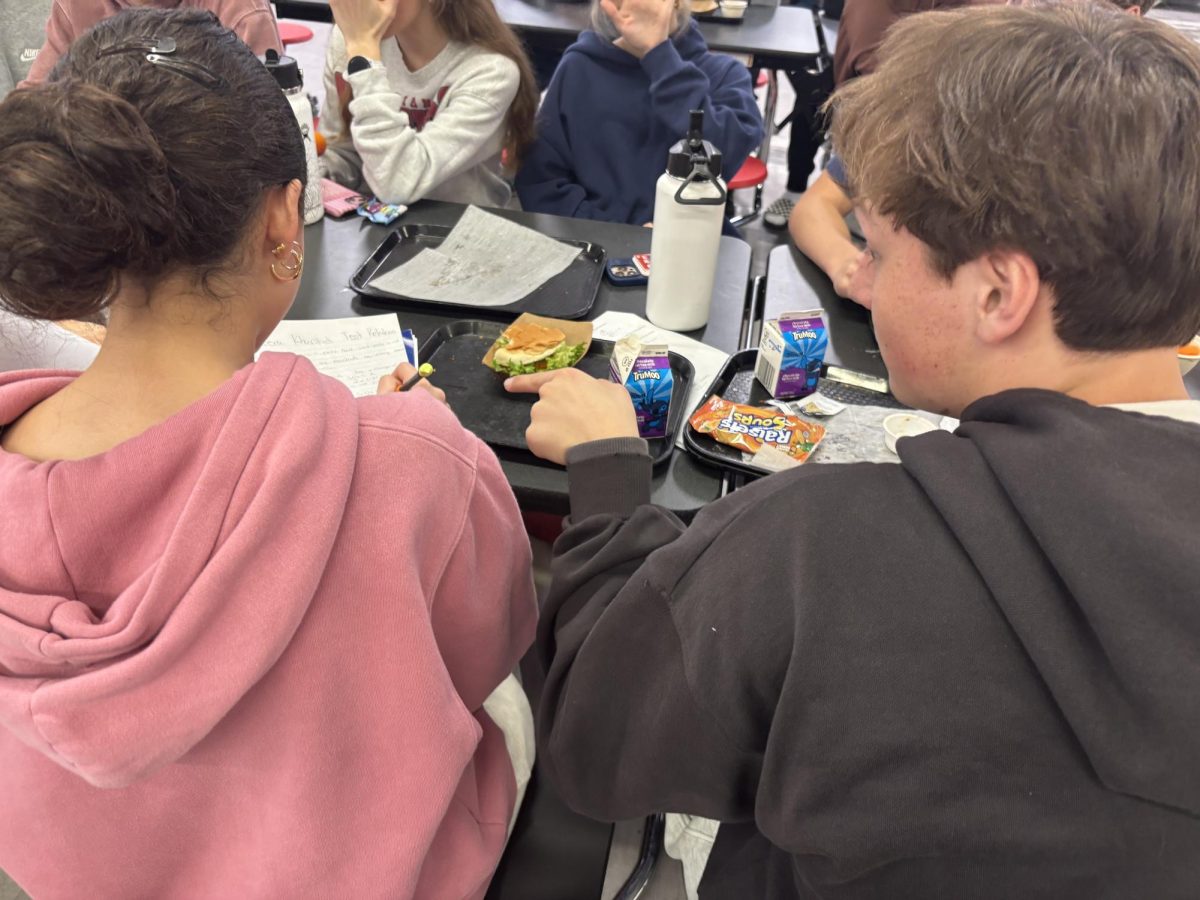 Sophomore Meera Khurshid working on her chemistry homework during lunch with sophomore Jack Dutkanych’s help. “I often stay up late finishing assignments so I have to sacrifice my sleep,” senior Kaelee Jacobs said.
