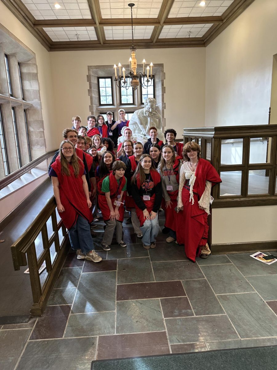 Latin club wears red togas to Fridays roman banquet. At the Roman banquet all of the people attend the convention wear togas and eat food.  I really enjoyed spending time with my friends at the The Roman Banquet" junior Juniper Shackelford.
